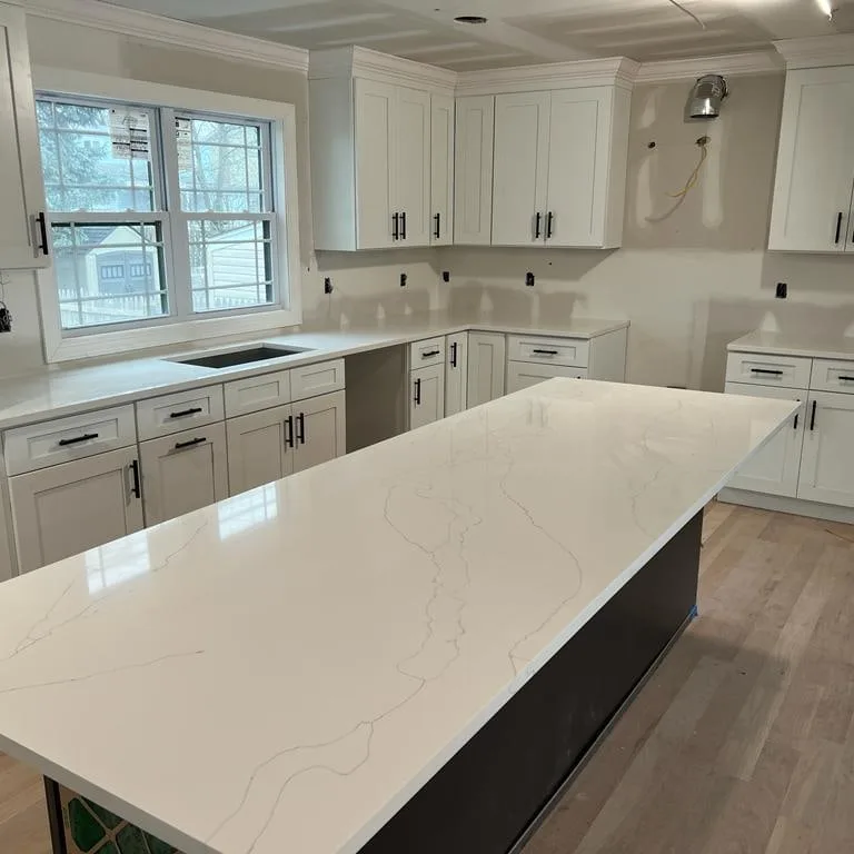 Calacatta quartz kitchen island fabricated by LG Granite